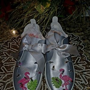 Silver Sneakers with Flamingo Embellishments